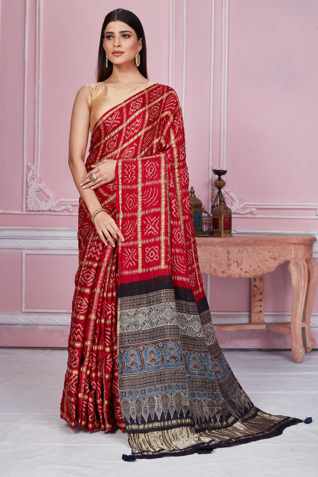 Shop beautiful red Ghatchola saree online in USA with Ajrakh pallu. Look your best on festive occasions in latest designer sarees, pure silk sarees, Kanjivaram silk saris, handwoven saris, tussar silk saris, embroidered saris from Pure Elegance Indian clothing store in USA.-full view