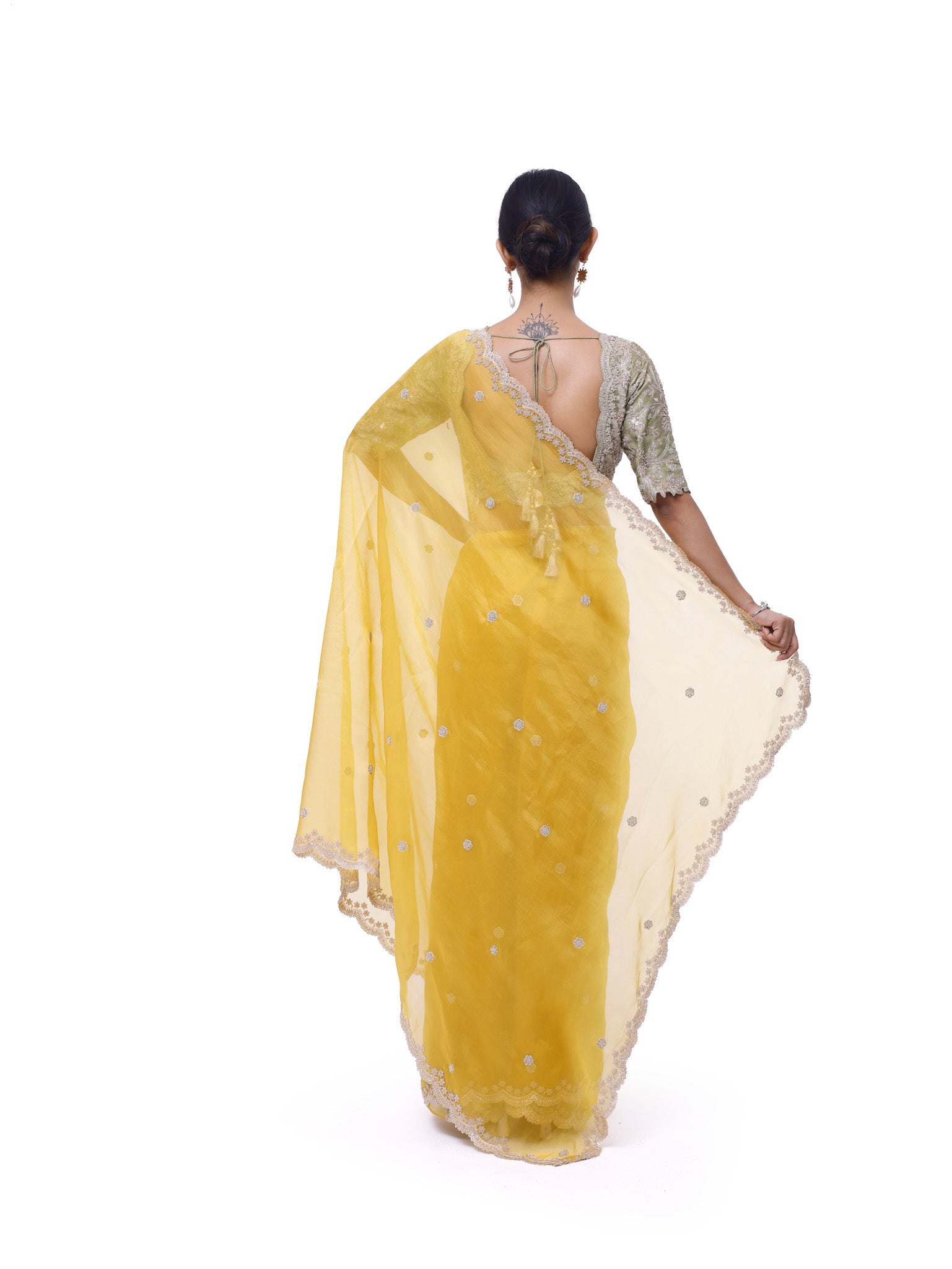 Buy yellow embroidered organza saree online in USA with green embroidered blouse. Look like a royalty in exquisite designer sarees, embroidered sarees, handwoven sarees, pure silk saris, Banarasi sarees, Kanjivaram sarees from Pure Elegance Indian saree store in USA.-back