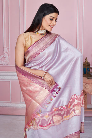 Shop stunning lilac Banarasi saree online in USA with silver zari work. Look your best on festive occasions in latest designer saris, pure silk sarees, Kanjivaram silk sarees, handwoven saris, tussar silk sarees, embroidered saris from Pure Elegance Indian fashion store in USA.-closeup