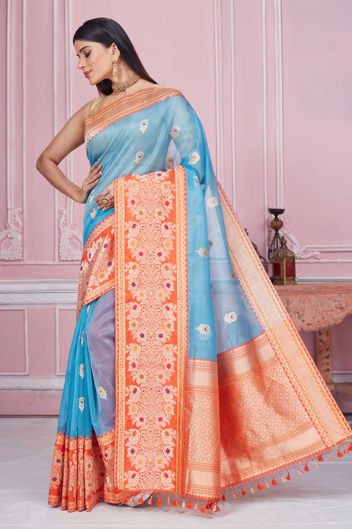 Buy light blue Banarasi sari online in USA with red zari border. Look your best on festive occasions in latest designer saris, pure silk sarees, Kanjivaram silk sarees, handwoven saris, tussar silk sarees, embroidered saris from Pure Elegance Indian fashion store in USA.-pallu
