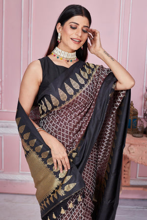 Shop beautiful brown Banarasi sari online in USA with black zari border. Look your best on festive occasions in latest designer saris, pure silk sarees, Kanjivaram silk sarees, handwoven saris, tussar silk sarees, embroidered saris from Pure Elegance Indian fashion store in USA.-closeup