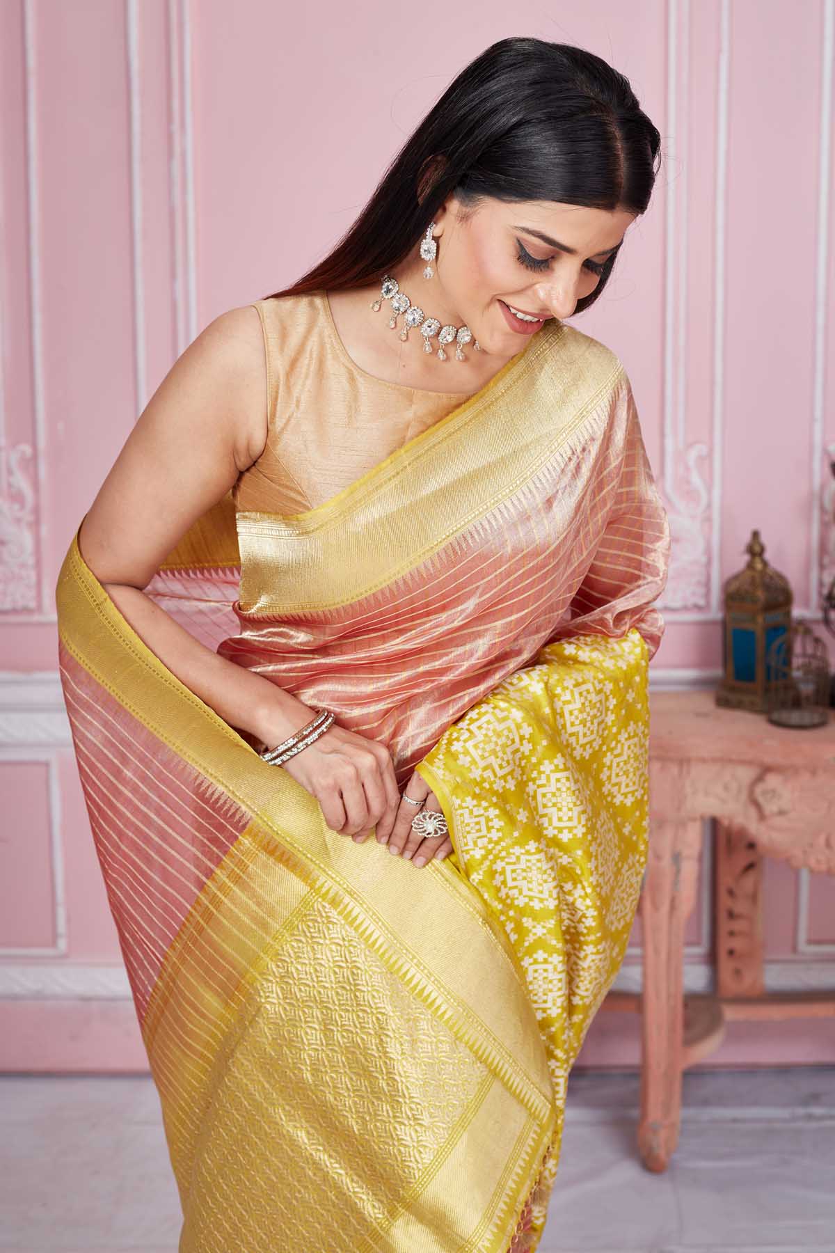 Buy pink Banarasi sari online in USA with yellow zari border and pallu. Look your best on festive occasions in latest designer saris, pure silk sarees, Kanjivaram silk sarees, handwoven saris, tussar silk sarees, embroidered saris from Pure Elegance Indian fashion store in USA.-closeup