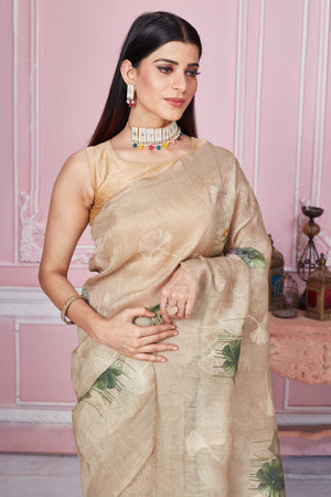 Buy stunning beige floral print Banarasi saree online in USA. Look your best on festive occasions in latest designer sarees, pure silk saris, Kanchipuram silk sarees, handwoven sarees, tussar silk saris, embroidered sarees from Pure Elegance Indian fashion store in USA.-closeup