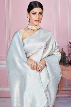 Shop powder blue floral Banarasi saree online in USA with zari border. Look your best on festive occasions in latest designer sarees, pure silk saris, Kanchipuram silk sarees, handwoven sarees, tussar silk saris, embroidered sarees from Pure Elegance Indian fashion store in USA.-closeup