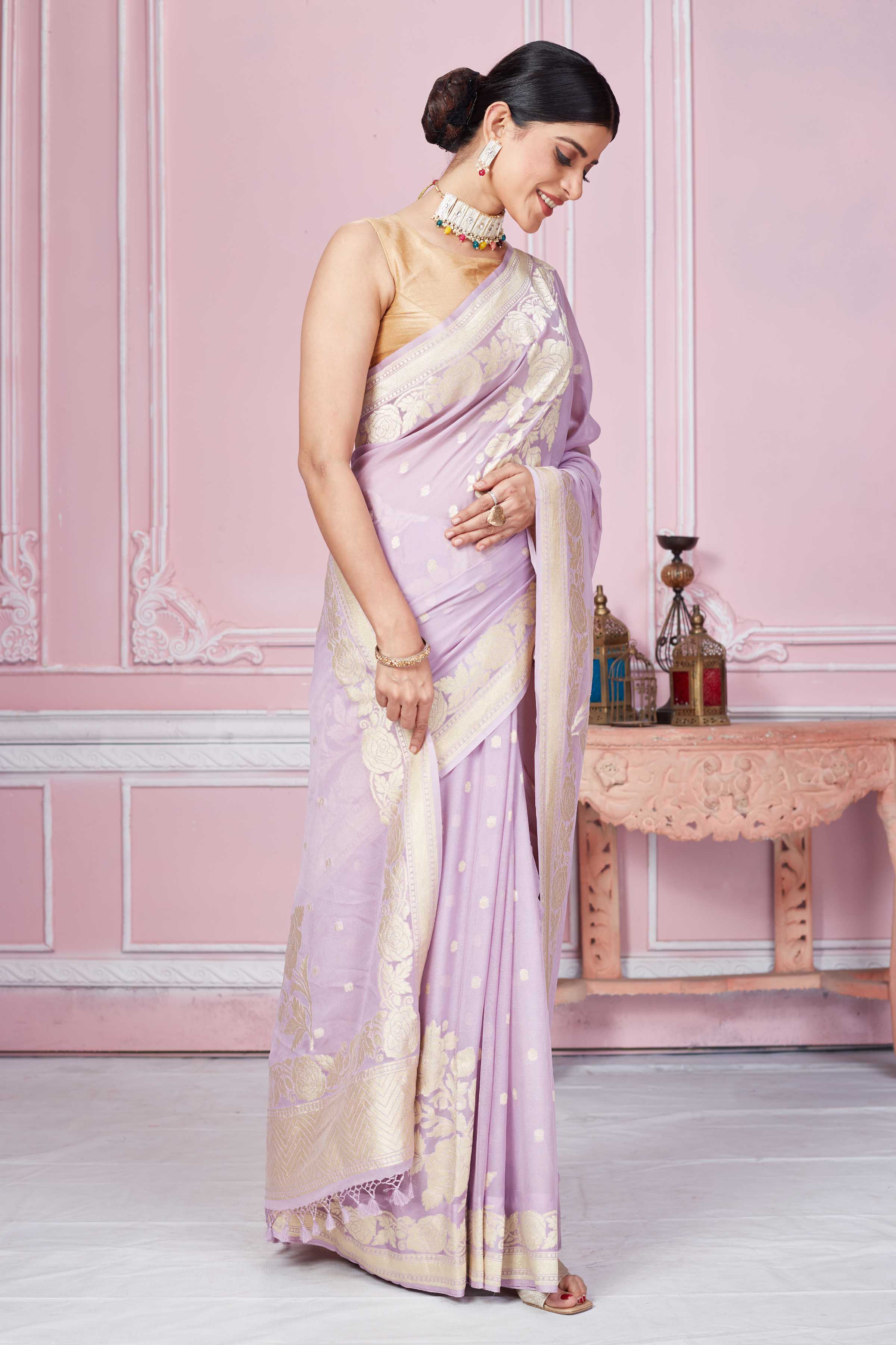 Shop lilac Banarasi sari online in USA with floral zari work. Look your best on festive occasions in latest designer sarees, pure silk saris, Kanchipuram silk sarees, handwoven sarees, tussar silk saris, embroidered sarees from Pure Elegance Indian fashion store in USA.-side