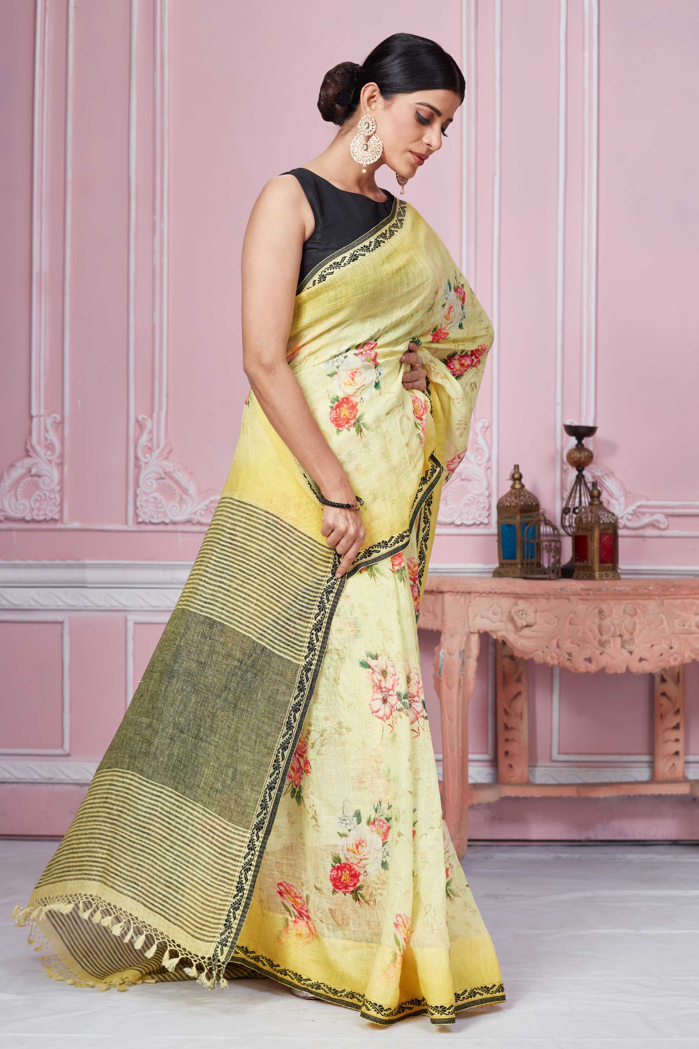 Buy yellow floral print linen saree online in USA with striped pallu. Look your best on festive occasions in latest designer sarees, pure silk saris, Kanchipuram silk sarees, handwoven sarees, tussar silk saris, embroidered sarees from Pure Elegance Indian fashion store in USA.-side
