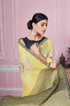 Buy yellow floral print linen saree online in USA with striped pallu. Look your best on festive occasions in latest designer sarees, pure silk saris, Kanchipuram silk sarees, handwoven sarees, tussar silk saris, embroidered sarees from Pure Elegance Indian fashion store in USA.-closeup