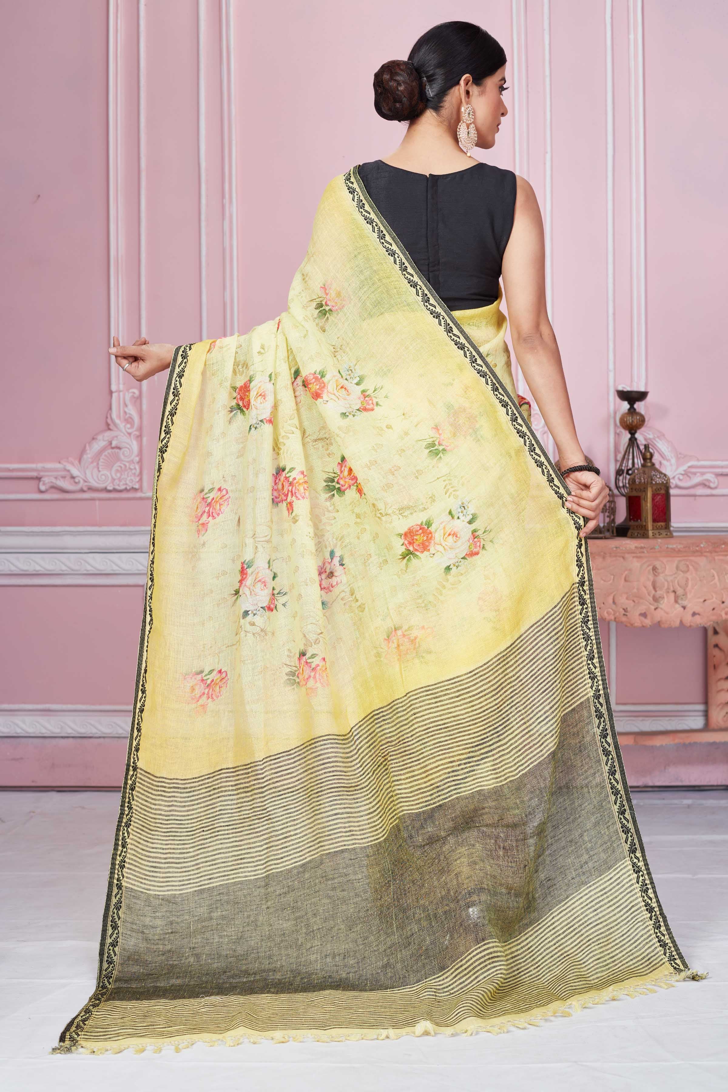 Buy yellow floral print linen saree online in USA with striped pallu. Look your best on festive occasions in latest designer sarees, pure silk saris, Kanchipuram silk sarees, handwoven sarees, tussar silk saris, embroidered sarees from Pure Elegance Indian fashion store in USA.-back