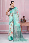 Shop stunning pastel green floral linen saree online in USA. Look your best on festive occasions in latest designer sarees, pure silk saris, Kanchipuram silk sarees, handwoven sarees, tussar silk saris, embroidered sarees from Pure Elegance Indian fashion store in USA.-full view