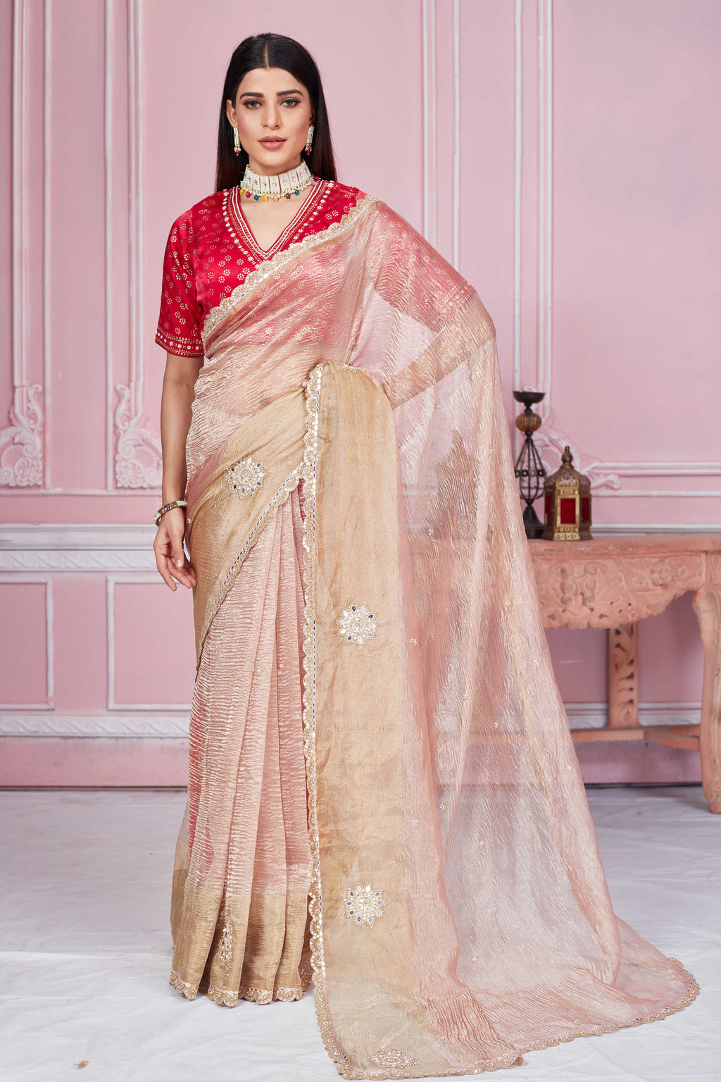 Buy champagne pink tissue silk sari online in USA with red blouse. Look your best on festive occasions in latest designer sarees, pure silk sarees, Kanjivaram silk saris, handwoven saris, tussar silk sarees, embroidered saris from Pure Elegance Indian clothing store in USA.-full view