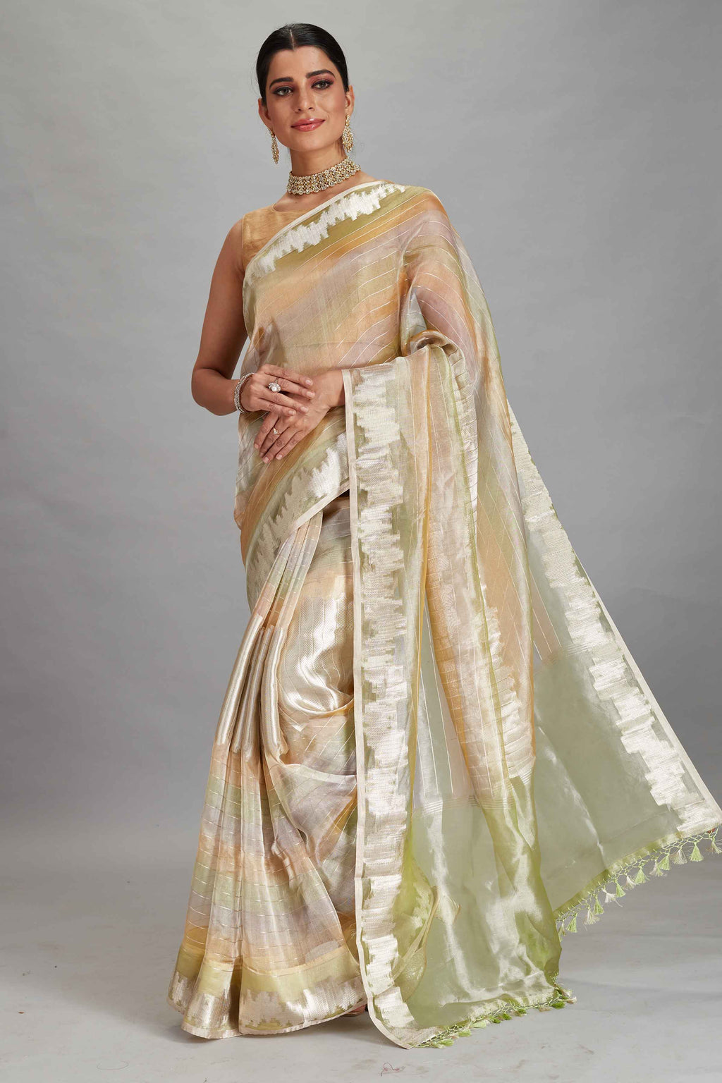 Buy green and peach striped tissue Banarasi saree online in USA. Look your best on festive occasions in latest designer sarees, pure silk sarees, Kanjivaram silk saris, handwoven saris, tussar silk sarees, embroidered saris from Pure Elegance Indian clothing store in USA.-full view