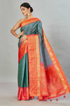Shop green striped Kanjivaram silk sari online in USA with red zari border. Look your best on festive occasions in latest designer sarees, pure silk sarees, Kanjivaram silk saris, handwoven saris, tussar silk sarees, embroidered saris from Pure Elegance Indian clothing store in USA.-full view