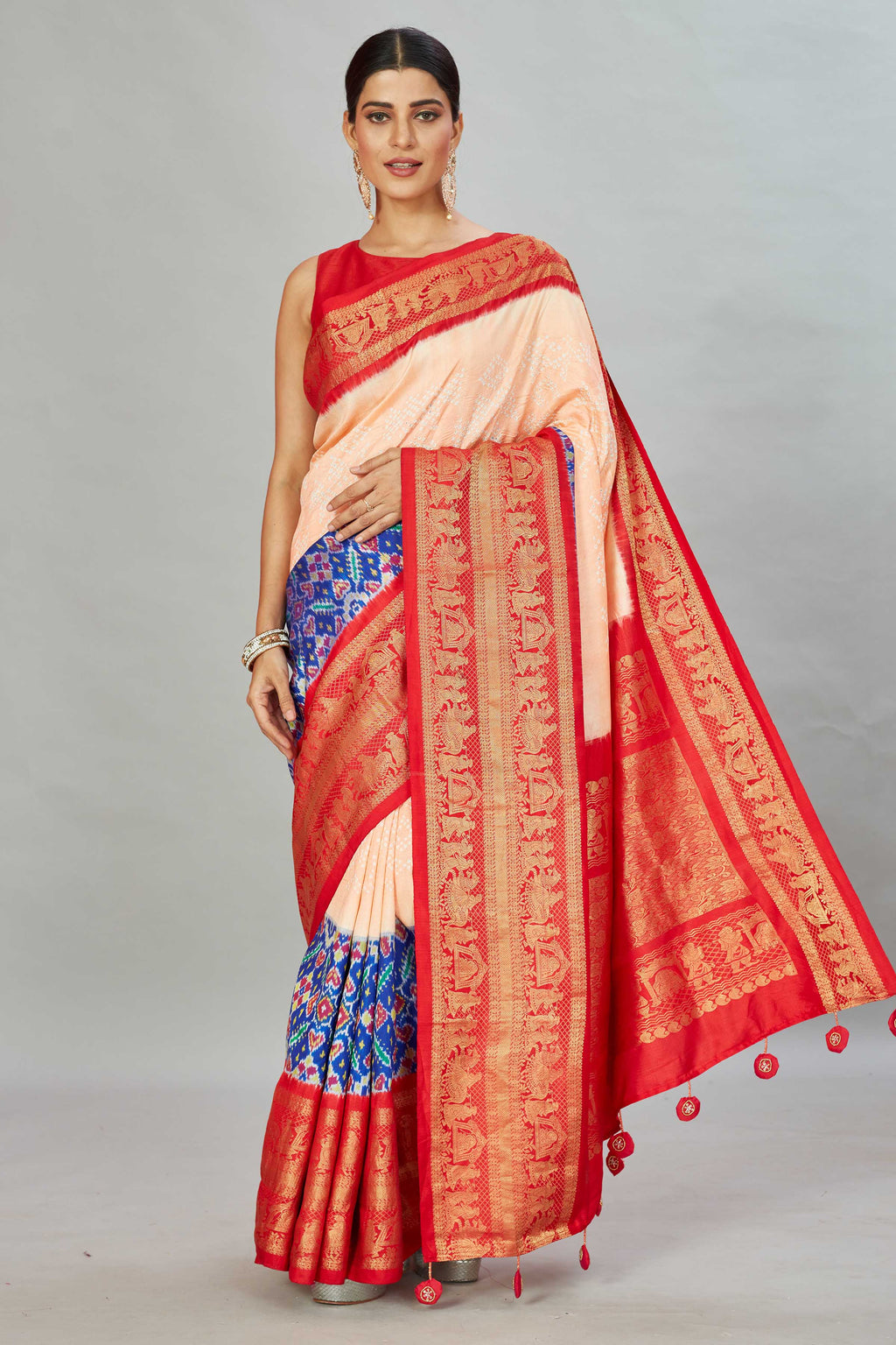 Shop peach bandhej Kanjivaram silk saree online in USA with blue ikkat border. Look your best on festive occasions in latest designer sarees, pure silk sarees, Kanjivaram silk saris, handwoven saris, tussar silk sarees, embroidered saris from Pure Elegance Indian clothing store in USA.-full view
