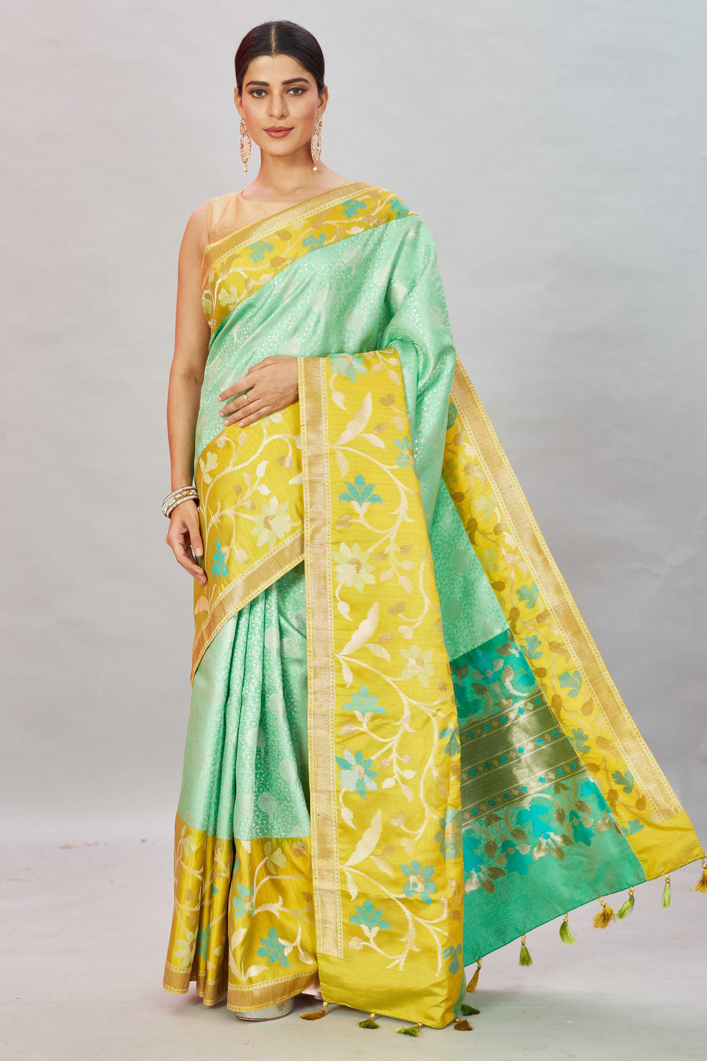 Buy pastel green Kanjivaram silk sari online in USA with yellow floral border. Look your best on festive occasions in latest designer sarees, pure silk sarees, Kanjivaram silk saris, handwoven saris, tussar silk sarees, embroidered saris from Pure Elegance Indian clothing store in USA.-full view