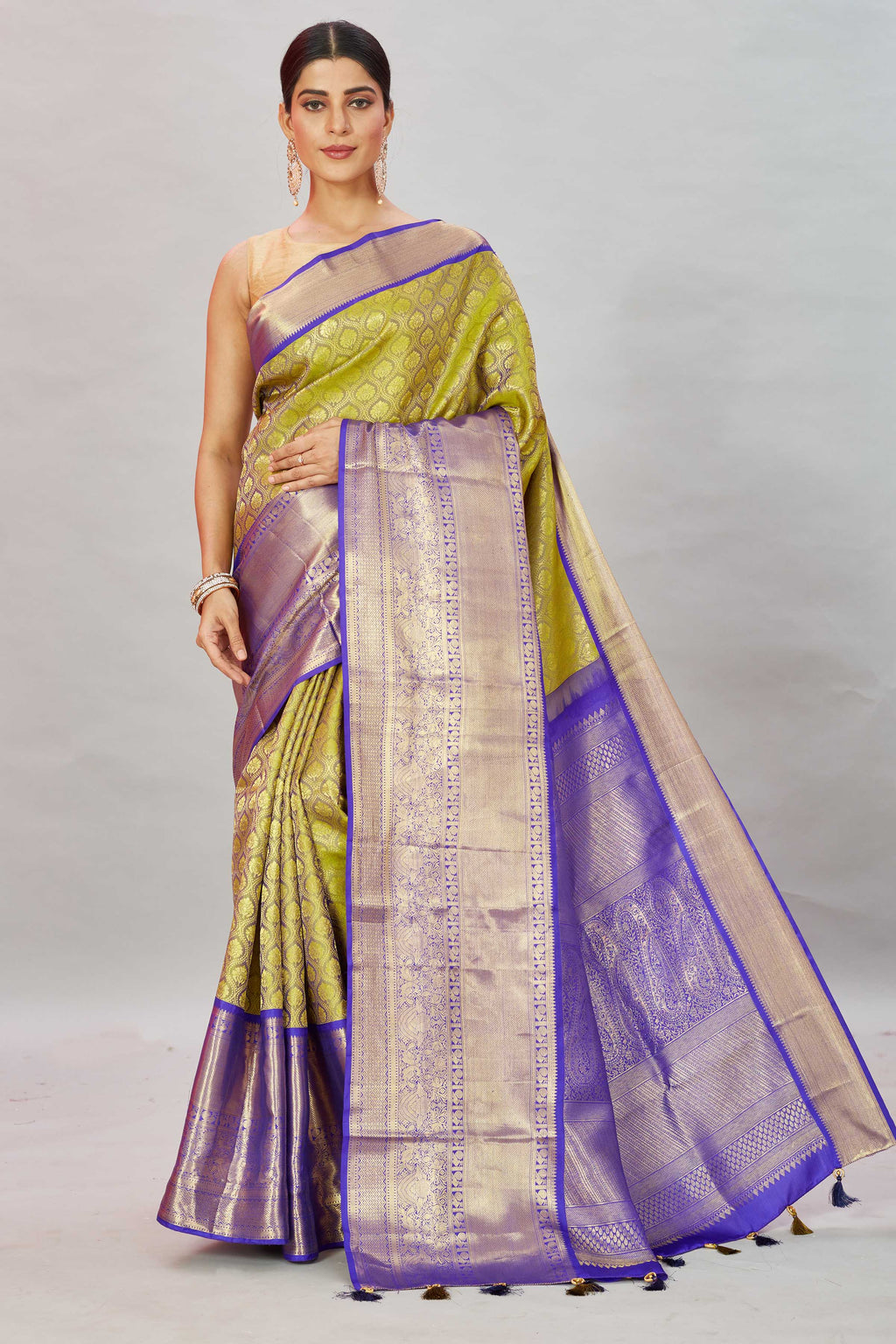 Shop pista  green Kanjivaram silk sari online in USA with purple border. Look your best on festive occasions in latest designer sarees, pure silk sarees, Kanjivaram silk saris, handwoven saris, tussar silk sarees, embroidered saris from Pure Elegance Indian clothing store in USA.-full view
