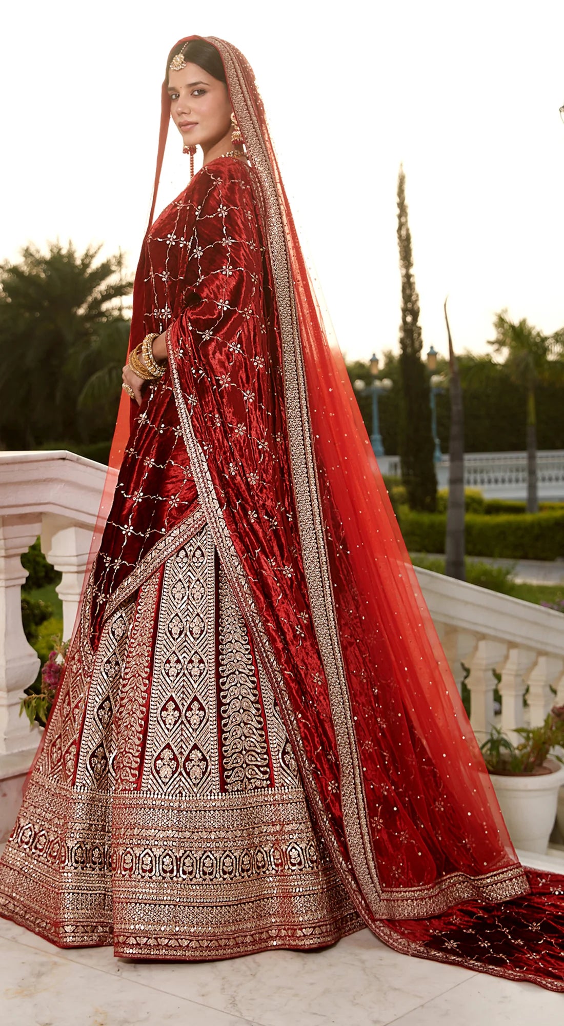 Shop brick red embroidered designer lehenga with double dupatta online in USA. Radiate elegance and class in designer lehengas, designer sarees, embroidered lehenga, bridal lehenga from Pure Elegance Indian fashion store in USA.-side