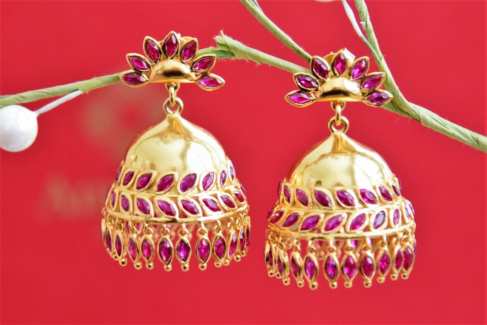 Buy beautiful gold plated red stone jhumki earrings online in USA. Buy exclusive Indian jewelry, gold plated earrings, silver earrings, gold plated necklace from Amrapali in USA available at Pure Elegance Indian fashion store.-front
