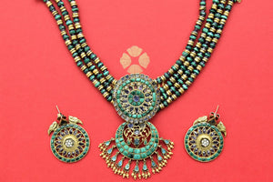 Buy beautiful heavy green and blue stone gold plated necklace set online in USA. Get ready for festive occasions in beautiful gold plated jewelry , silver jewelry , wedding jewelry, bridal jewelry by Amrapali from Pure Elegance Indian fashion store in USA.-full view