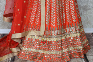 Shop the beautiful feminine coral raw silk embroidery lehenga with a cream silk embroidered blouse and peach sheer net dupatta to weddings. The authentically handcrafted silk lehenga will instantly glorify your look. Shop Indian dress online, designer lehenga online or visit Pure Elegance store in USA. - lehenga skirt