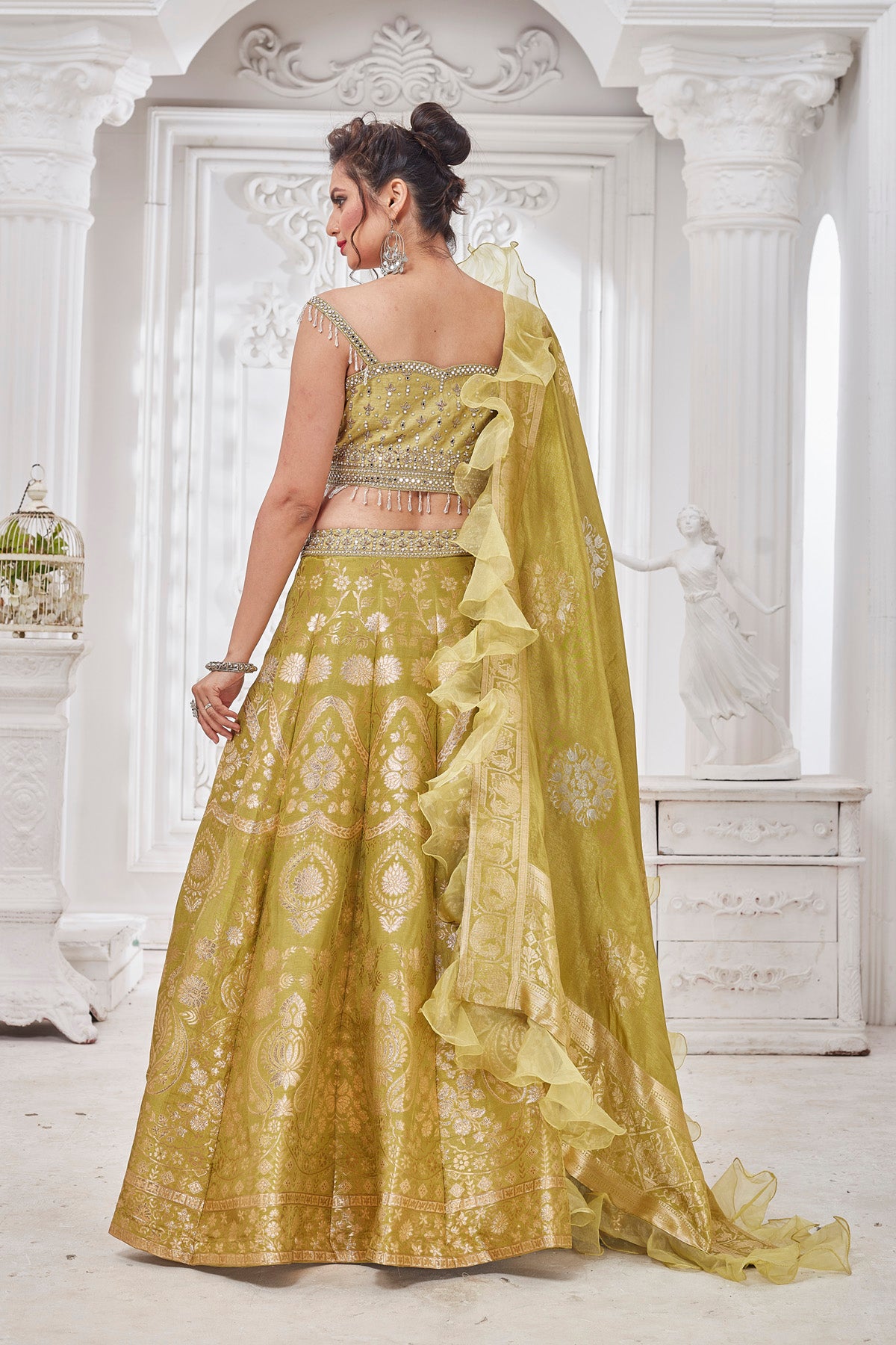 Buy beautiful pista green embroidered designer lehenga online in USA with ruffle dupatta. Get set for weddings and festive occasions in exclusive designer Anarkali suits, wedding gown, salwar suits, gharara suits, Indowestern dresses from Pure Elegance Indian fashion store in USA.-back