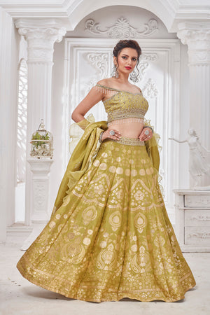 Buy beautiful pista green embroidered designer lehenga online in USA with ruffle dupatta. Get set for weddings and festive occasions in exclusive designer Anarkali suits, wedding gown, salwar suits, gharara suits, Indowestern dresses from Pure Elegance Indian fashion store in USA.-left