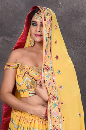 Buy stunning yellow embroidered off-shoulder designer lehenga online in USA with dupatta. Radiate ethnic glam on special occasions in beautiful designer lehengas, Anarkali suits, Indowestern dresses, designer gown, salwar suits from Pure Elegance Indian fashion store in USA,-closeup
