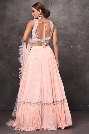 Buy stunning powder pink mirror work designer lehenga online in USA with dupatta. Get set for weddings and festive occasions in exclusive designer Anarkali suits, wedding gown, salwar suits, gharara suits, Indowestern dresses from Pure Elegance Indian fashion store in USA.-back