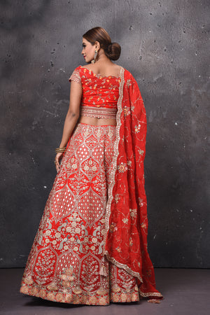 Shop beautiful red embroidered bridal lehenga online in USA with dupatta. Get set for weddings and festive occasions in exclusive designer Anarkali suits, wedding gown, salwar suits, gharara suits, Indowestern dresses from Pure Elegance Indian fashion store in USA.-back