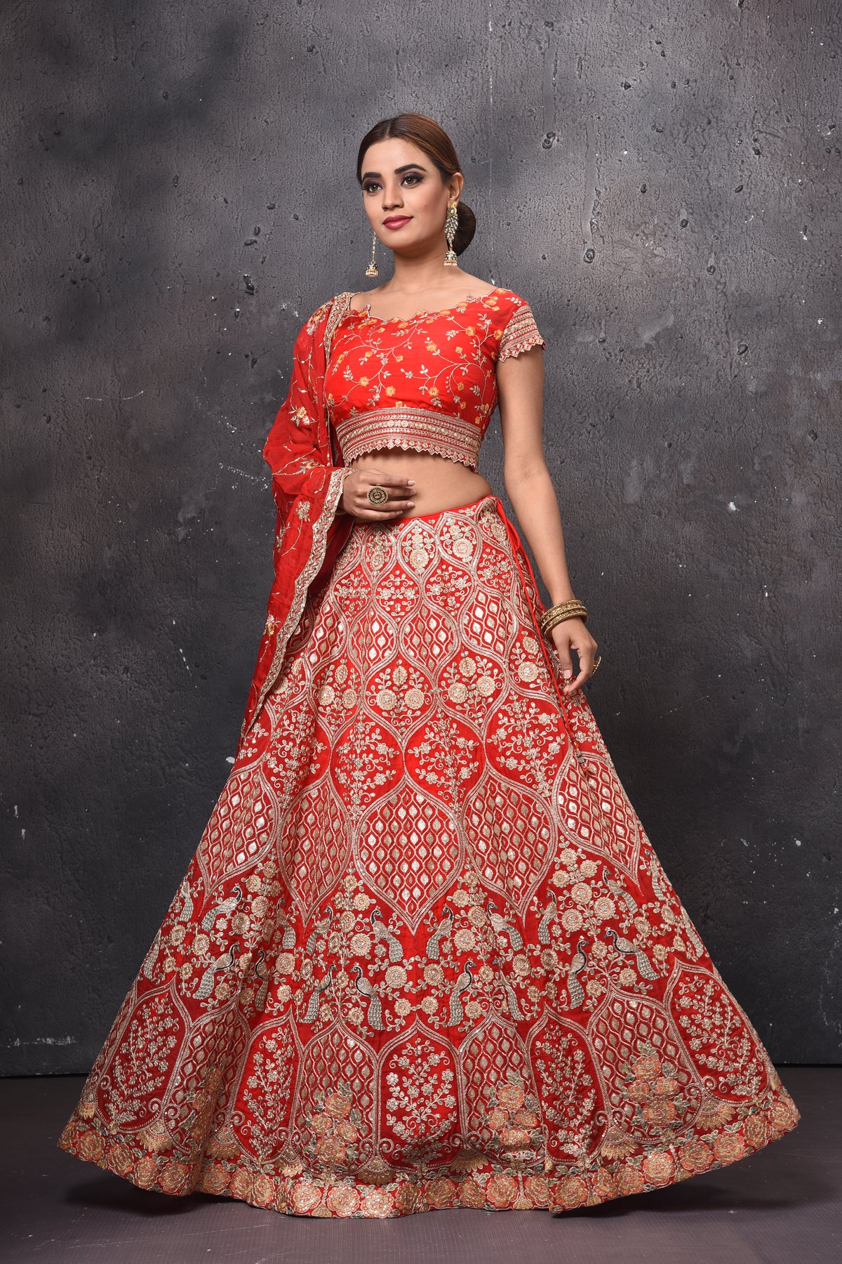 Shop beautiful red embroidered bridal lehenga online in USA with dupatta. Get set for weddings and festive occasions in exclusive designer Anarkali suits, wedding gown, salwar suits, gharara suits, Indowestern dresses from Pure Elegance Indian fashion store in USA.-left