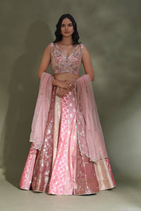Buy beautiful pink embroidered contemporary designer lehenga online in USA with dupatta. Look your best at weddings and parties in Indian dresses, designer lehengas, Anarkali suits, designer gowns, salwar suits, sharara suits from Pure Elegance Indian fashion store in USA.-full view
