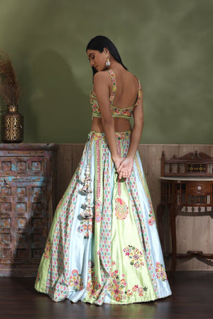 Shop stunning pastel green embroidered lehenga online in USA with yellow dupatta. Look your best at weddings and parties in Indian dresses, designer lehengas, Anarkali suits, designer gowns, salwar suits, sharara suits from Pure Elegance Indian fashion store in USA.-back