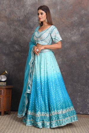 Shop ombre blue mirror work chanderi lehenga online in USA. Set a style statement on special occasions in exquisite designer lehengas, Anarkali suits, sharara suits, salwar suits, Indowestern outfits from Pure Elegance Indian fashion store in USA.-side