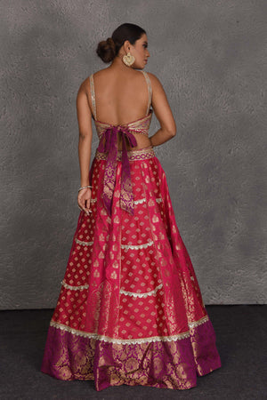 Buy pink and purple Banarasi embroidered lehenga online in USA with dupatta. Flaunt your Indian style on festive occasions in stunning designer lehengas, Anarkali suit, sharara suits, designer gowns, designer sarees, embroidered sarees from Pure Elegance India fashion store in USA. -back