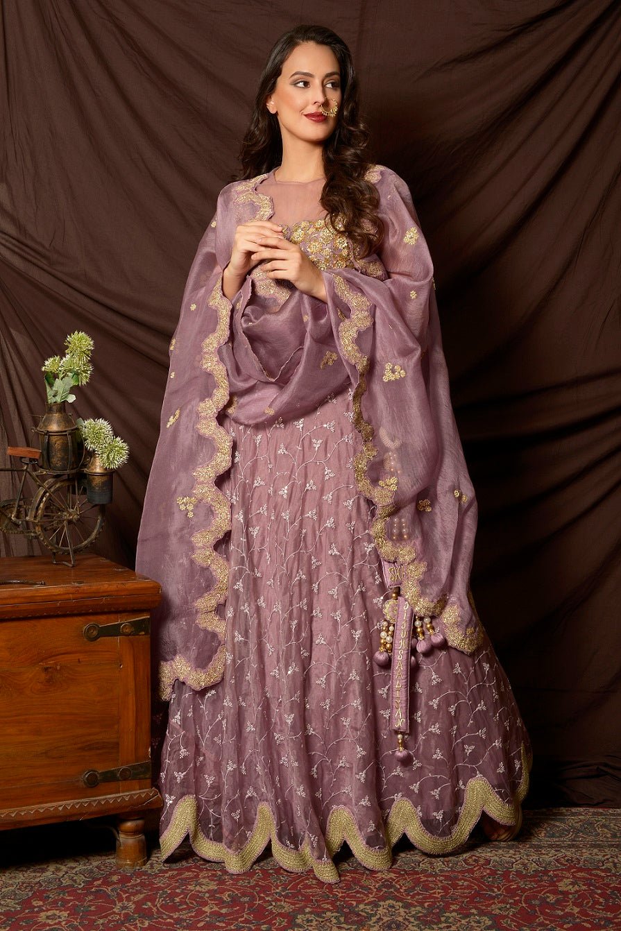Buy attractive mauve color embroidered organza lehenga online in USA with dupatta. Shine at weddings and special occasions with beautiful Indian designer dresses, gowns, lehengas from Pure Elegance Indian clothing store in USA.-full view