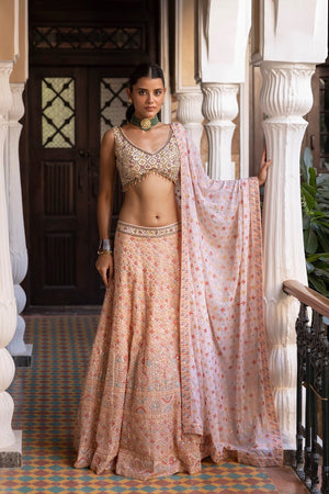 Buy powder pink georgette lehenga online in USA with dupatta. Dazzle on weddings and special occasions with exquisite Indian designer dresses, sharara suits, Anarkali suits, bridal lehengas, sharara suits from Pure Elegance Indian clothing store in USA.-front