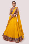 Shop the Look your best on wedding occasions in this mustard color lehenga with the multicolor blouse and a beautiful dupatta. Dazzle on weddings and special occasions with exquisite Indian designer dresses, sharara suits, Anarkali suits, bridal lehengas, and sharara suits from Pure Elegance Indian clothing store in the USA. Shop online from Pure Elegance.