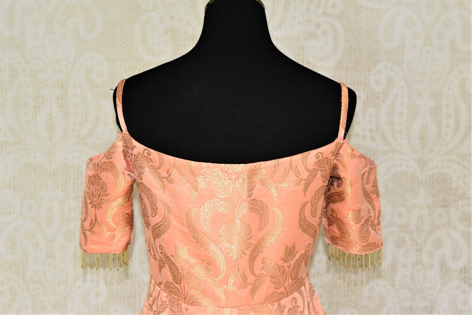 Buy beautiful peach Banarasi silk designer gown online in USA. Add brilliance to your Indian look with alluring Indian designer wedding dresses available at Pure Elegance Indian clothing store for women in USA or shop online.-back