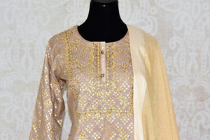 Buy beige color gota patti embroidery kurta with palazzo online in USA. Elevate your ethnic style with a range of captivating Indian designer clothing from Pure Elegance Indian clothing store in USA. Add designer suits, embroidered sarees, pure silk saris to your wardrobe for a beautiful look this festive season.-front