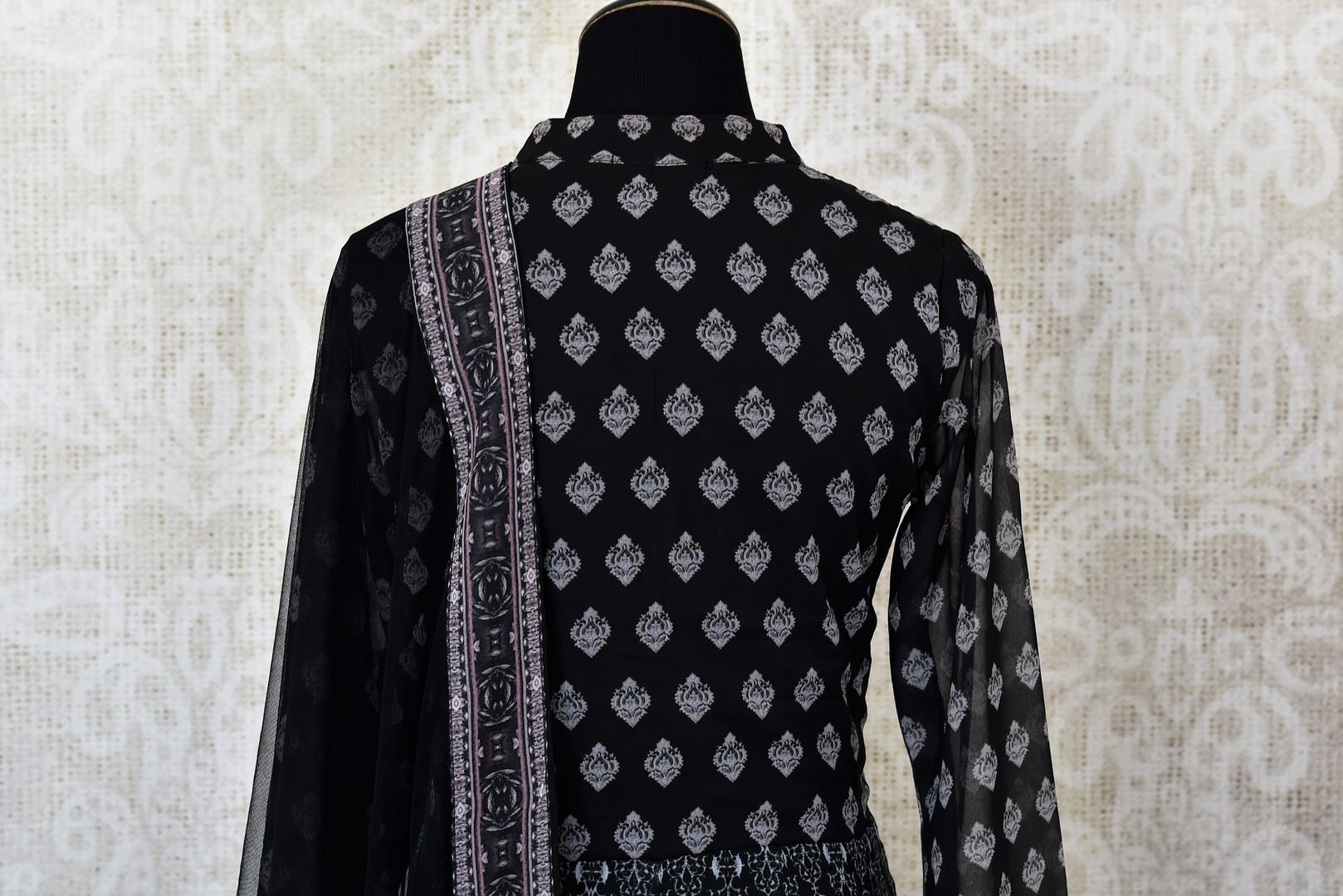 Black printed georgette Anarkali suit for online shopping in USA with dupatta. Get floored by a vibrant collection of Indian designer clothes at Pure Elegance Indian fashion store in USA. Choose from a beautiful range of Indian wedding dresses, designer lehengas and Anarkali suits for special occasions.-back