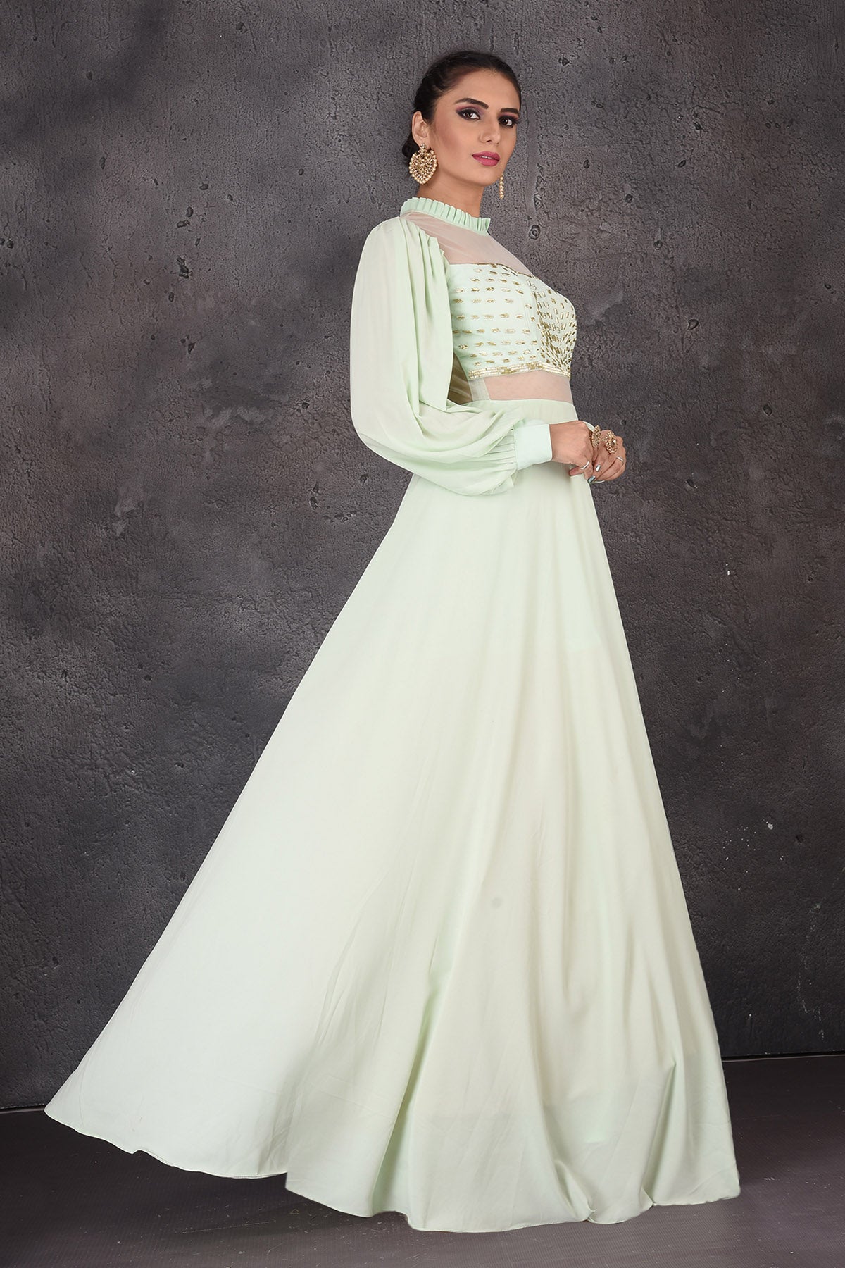 Shop beautiful mint green designer gown online in USA with puff sleeves. Look elegant at weddings and festive occasions in exclusive designer suits, designer gowns, Anarkali suits, sharara suits, wedding gowns, palazzo suits, designer lehenga from Pure Elegance Indian clothing store in USA.-side