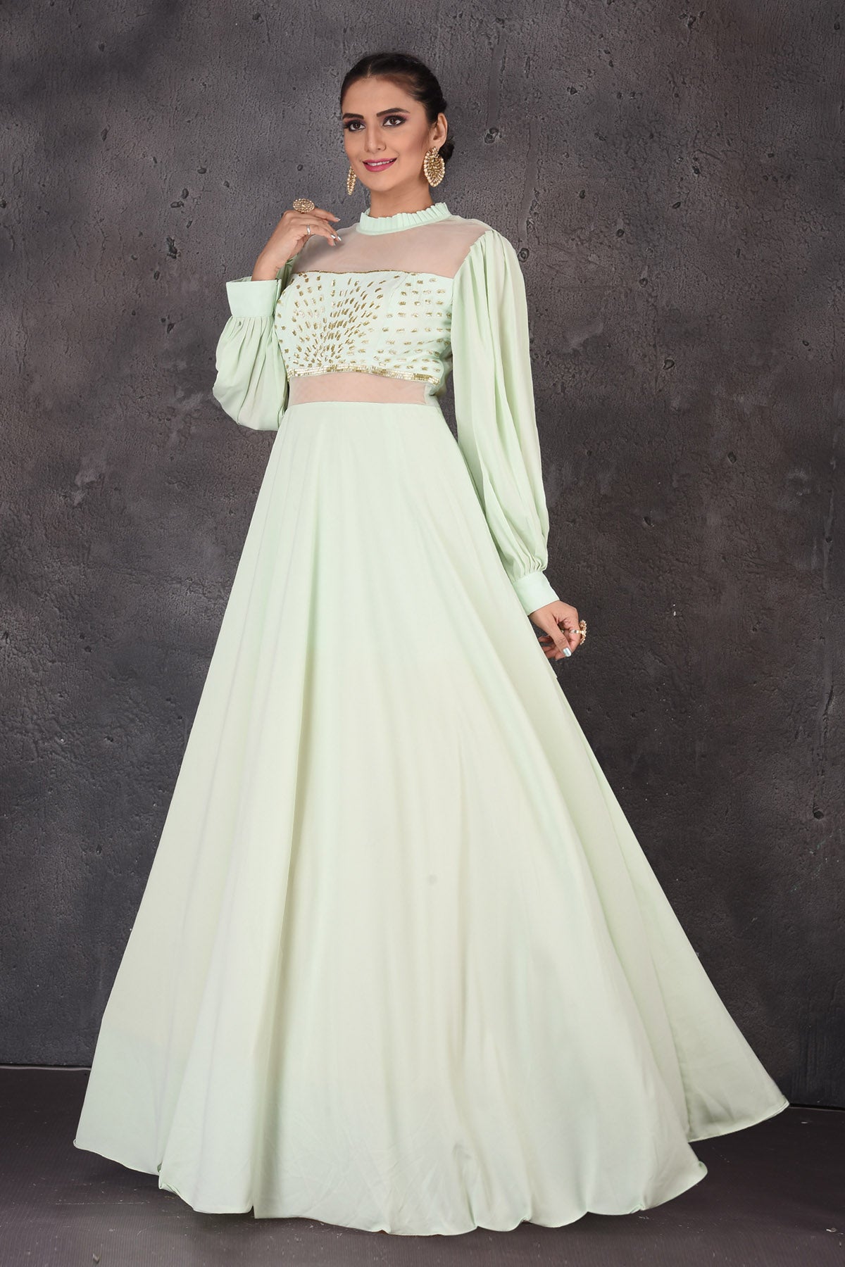 Shop beautiful mint green designer gown online in USA with puff sleeves. Look elegant at weddings and festive occasions in exclusive designer suits, designer gowns, Anarkali suits, sharara suits, wedding gowns, palazzo suits, designer lehenga from Pure Elegance Indian clothing store in USA.-right