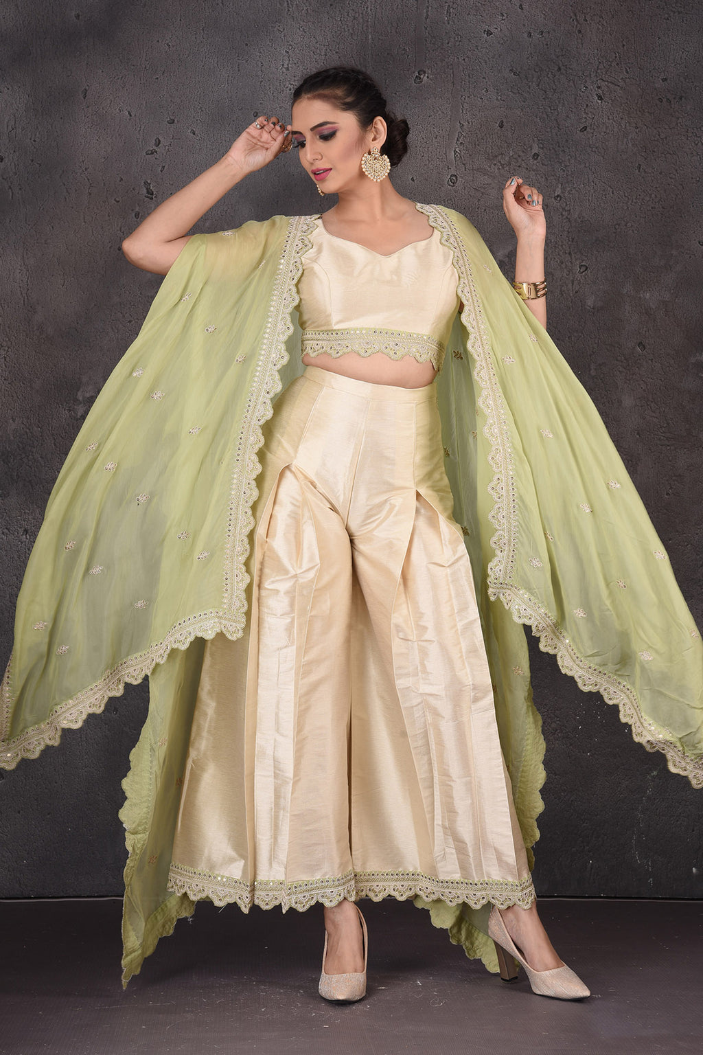Shop gold embroidered crop top online in USA with palazzo and pista green shrug. Look elegant at weddings and festive occasions in exclusive designer suits, designer gowns, Anarkali suits, sharara suits, wedding gowns, palazzo suits, designer lehenga from Pure Elegance Indian clothing store in USA.-full view