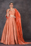 Shop stunning orange Banarasi  designer lehenga online in USA with dupatta. Look elegant at weddings and festive occasions in exclusive designer suits, designer gowns, Anarkali suits, sharara suits, wedding gowns, palazzo suits, designer lehenga from Pure Elegance Indian clothing store in USA.-full view