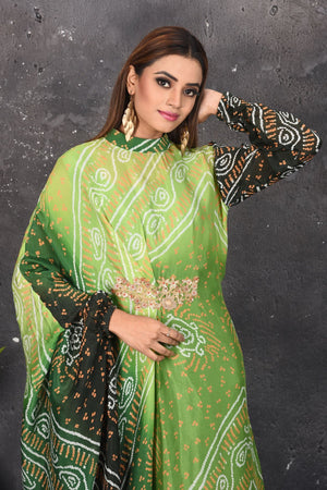Shop stunning ombre green bandhani draped dress online in USA. Be party ready with exclusive designer wear outfits. Indian designer suits, Anarkali dresses, palazzo suits, sharara suits from Pure Elegance Indian fashion store in USA.-closeup