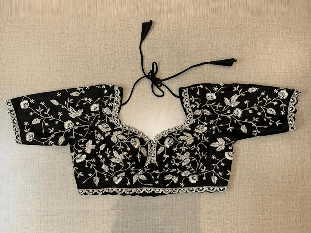 Buy stunning black heavy embroidery choli-cut saree blouse online in USA. Elevate your saree style with exquisite readymade saree blouses, embroidered saree blouses, Banarasi saree blouse, designer saree blouse, choli-cut blouses, corset blouses from Pure Elegance Indian clothing store in USA.-full view