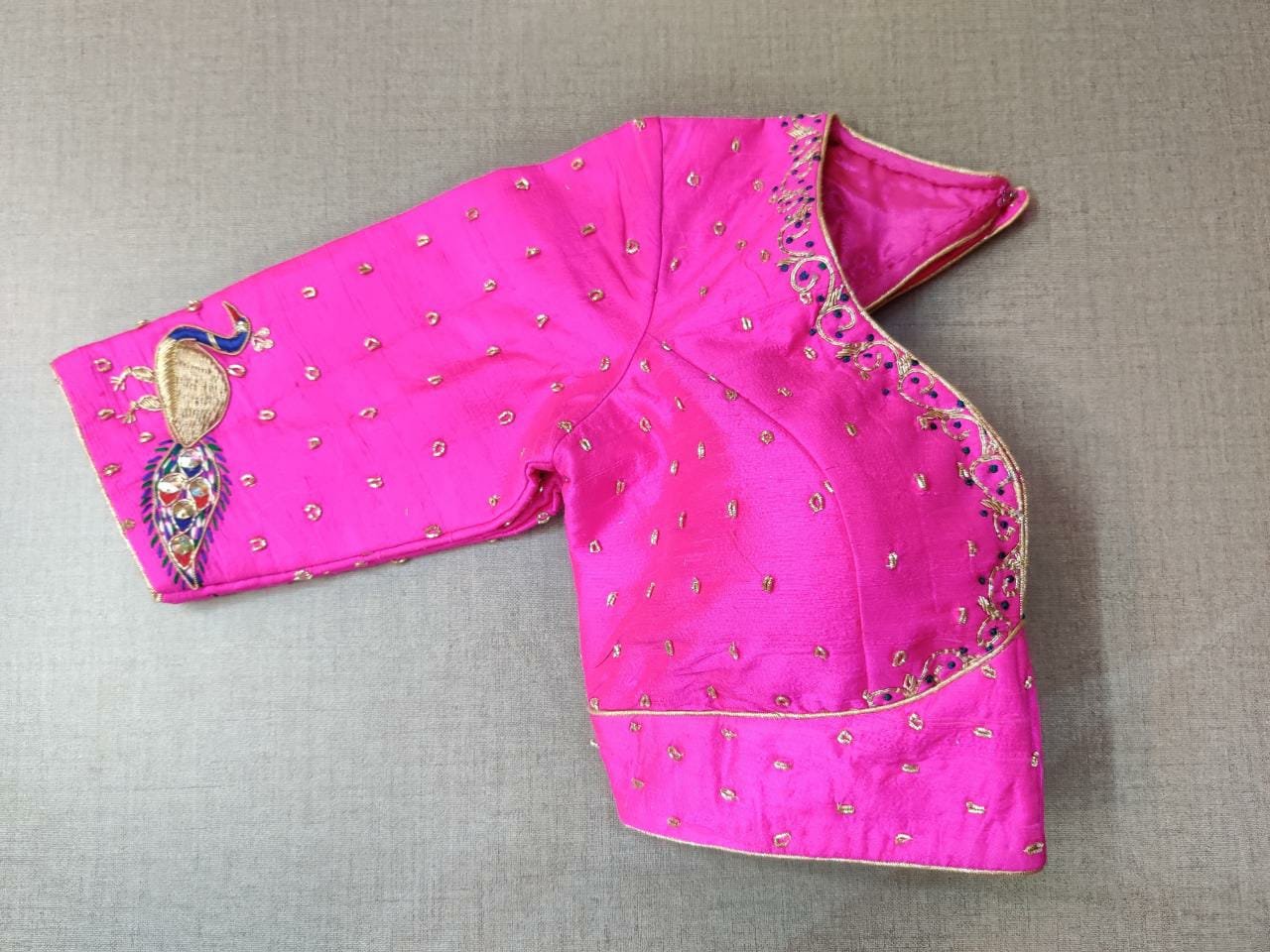 Shop stunning neon pink embroidered saree blouse online in USA with peacock motifs. Elevate your Indian ethnic saree looks with beautiful readymade sari blouse, embroidered saree blouses, Banarasi saree blouse, designer saree blouses, sleeveless saree blouses from Pure Elegance Indian fashion store in USA.-sleeves