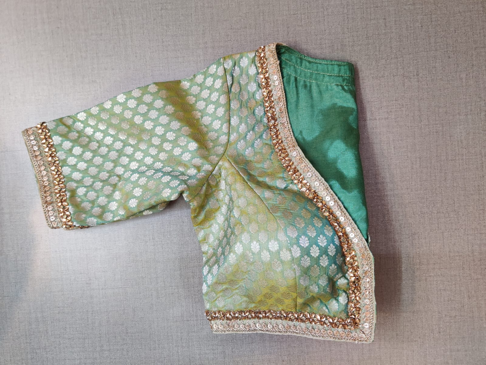 Shop stunning light green embroidered Banarasi saree blouse online in USA. Elevate your Indian ethnic saree looks with beautiful readymade sari blouse, embroidered saree blouses, Banarasi saree blouse, designer saree blouses, sleeveless saree blouses from Pure Elegance Indian fashion store in USA.-sleeves