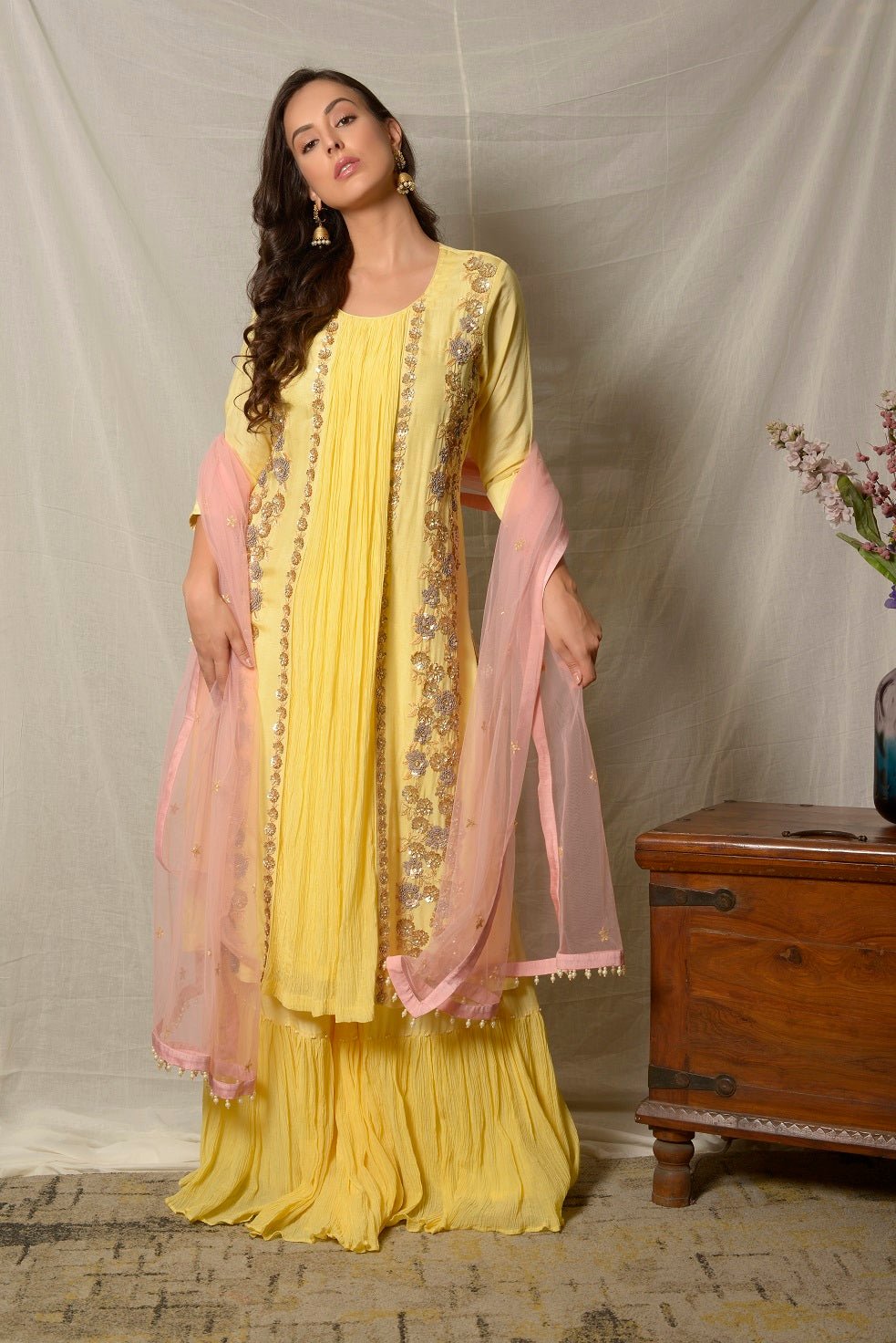 Shop stunning lemon yellow embroidered Uppada silk suit online in USA with pink dupatta. Shine at weddings and special occasions with beautiful Indian designer suits, gowns, lehengas from Pure Elegance Indian clothing store in USA.-front