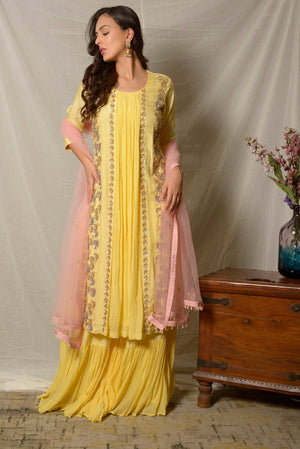 Shop stunning lemon yellow embroidered Uppada silk suit online in USA with pink dupatta. Shine at weddings and special occasions with beautiful Indian designer suits, gowns, lehengas from Pure Elegance Indian clothing store in USA.-side