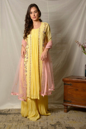 Shop stunning lemon yellow embroidered Uppada silk suit online in USA with pink dupatta. Shine at weddings and special occasions with beautiful Indian designer suits, gowns, lehengas from Pure Elegance Indian clothing store in USA.-suit